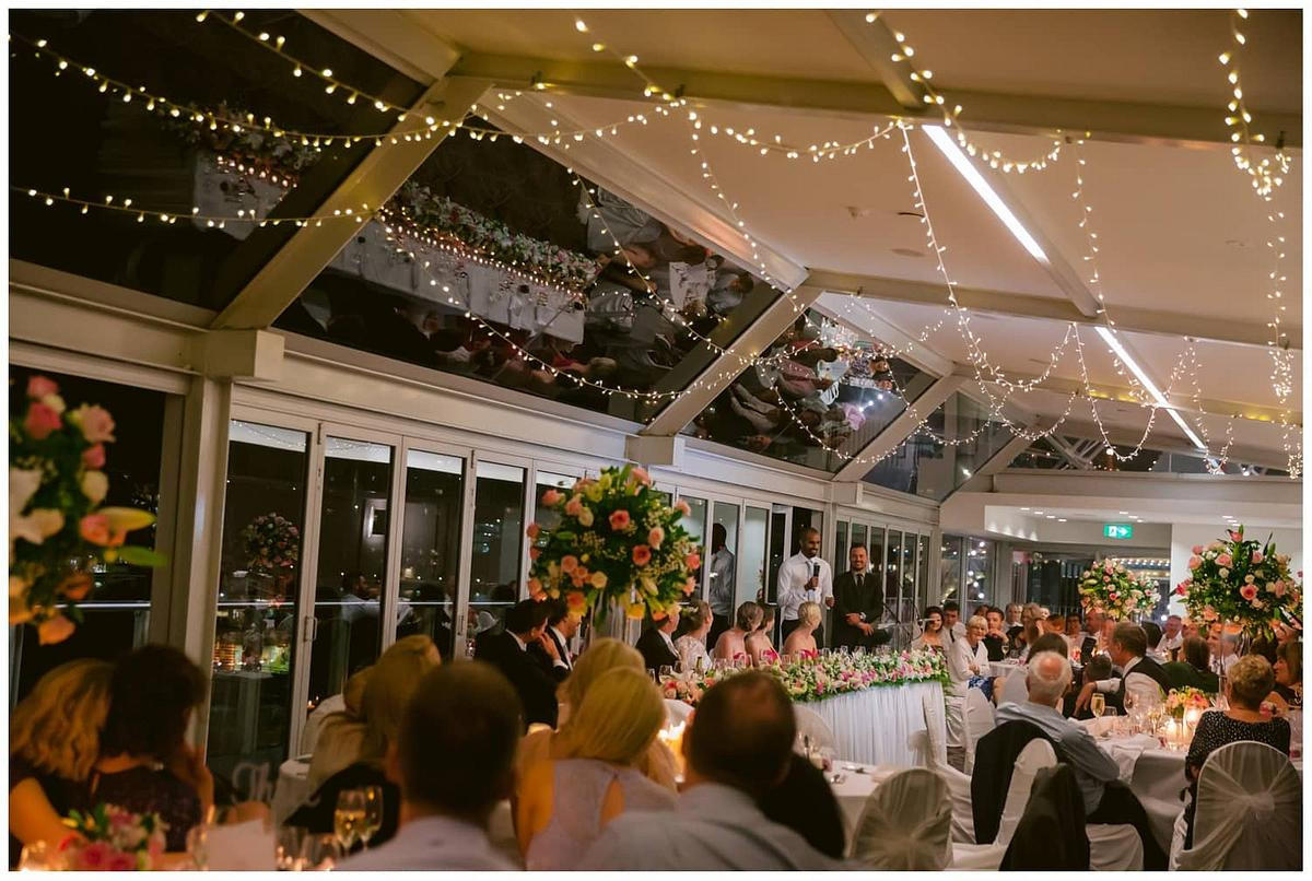 Best man sharing a funny story as the room bursts into laughter at Luna Park Sydney.