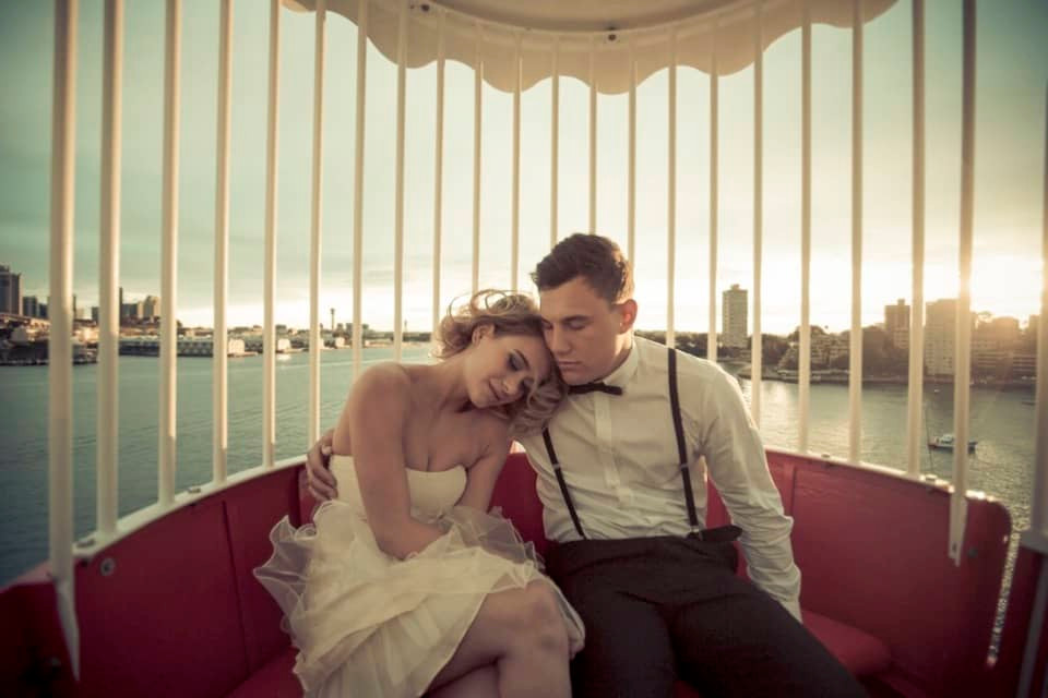 Ferris wheel at Luna Park Sydney during sunset.