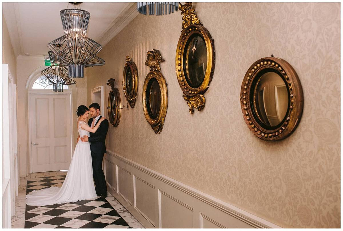 Natural and intimate wedding photo of the couple in the hallyway at Dunbar House Watsons Bay.